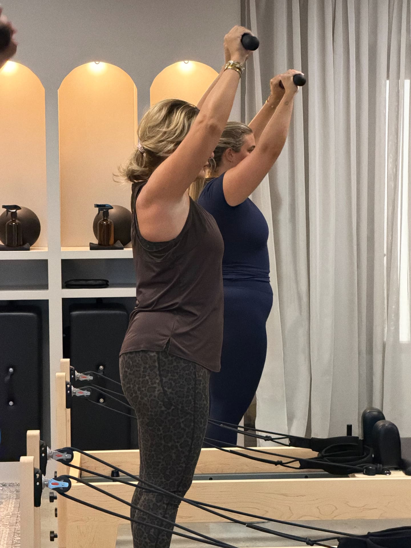 Overhead dumbbell work in a BED Debden Reformer class
