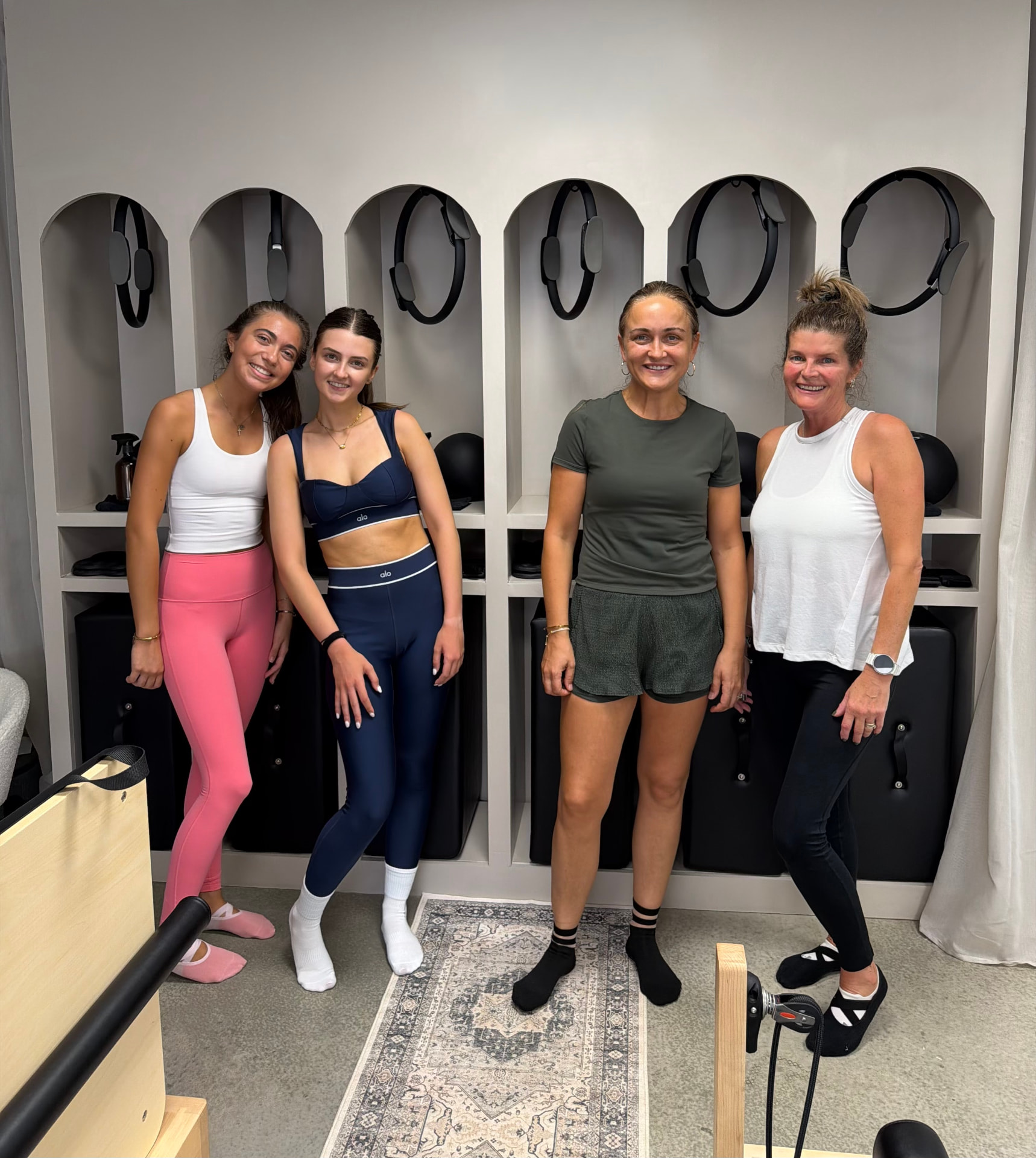 Four BED Debden members smiling in the studio after class